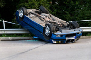 blue car rolled over